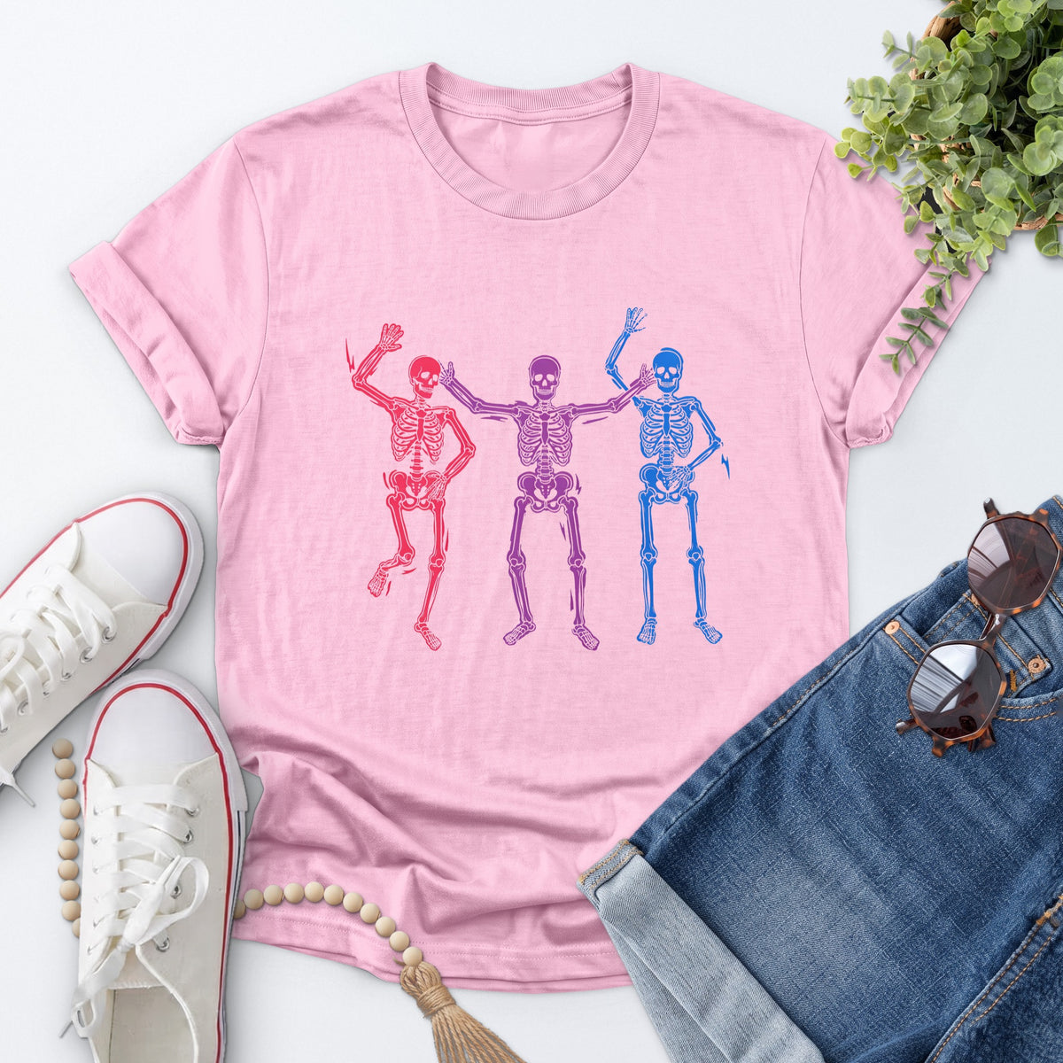 Dancing Skeleton Pride Tee — Light Pink