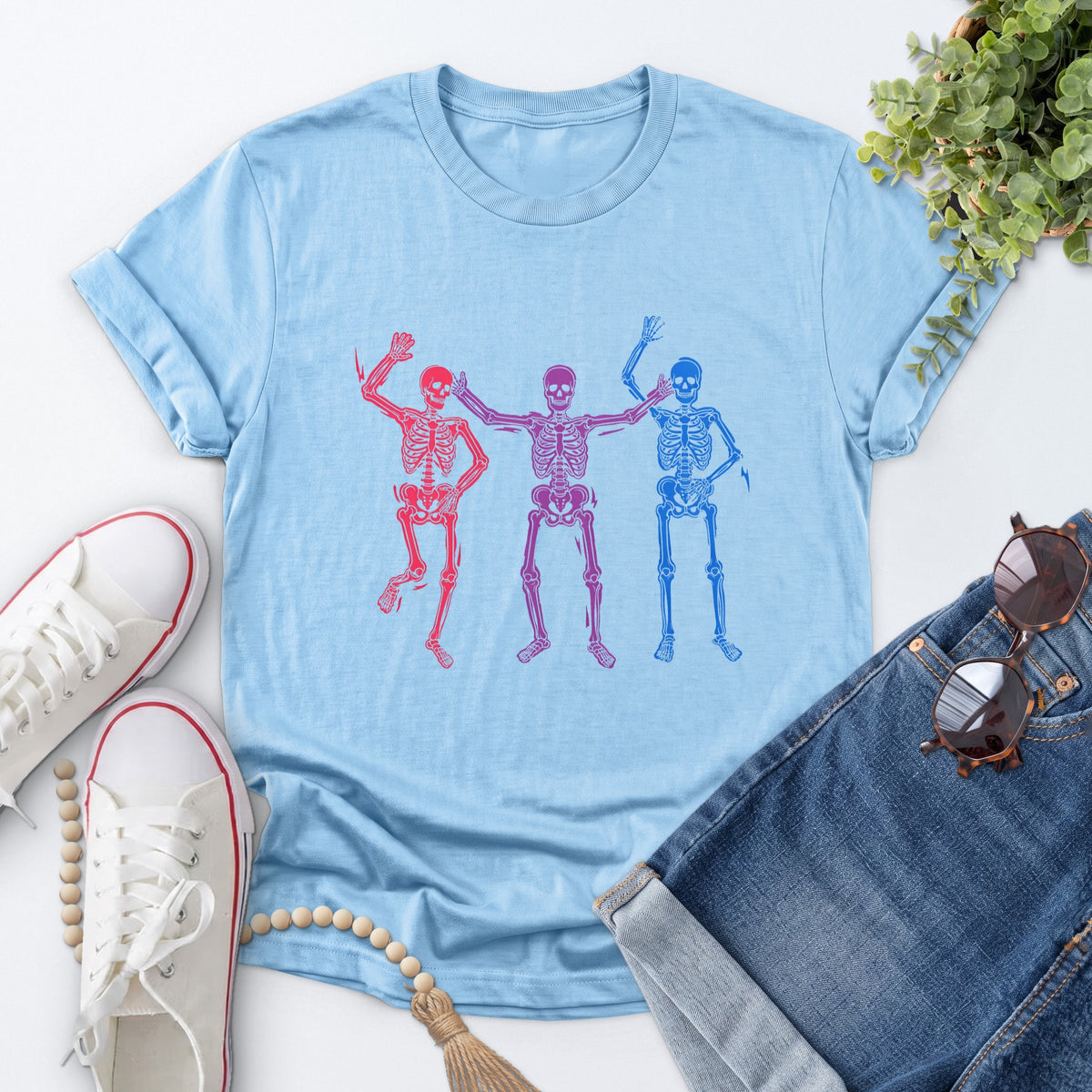 Dancing Skeleton Pride Tee — Light Blue